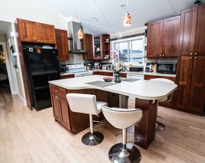 Upstairs kitchen - table shaped as grand piano