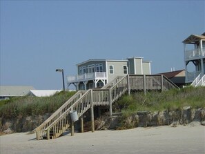 Public stairs over dunes, then 1-way street, house