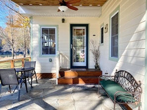 Outdoor Patio with Table, Chairs, and Bench.