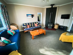Sunny lounge views to park below, games and magazines to enjoy. Cosy fireplace.