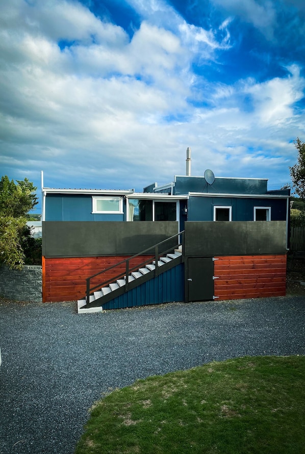 13 steps up to entry door, width of house is all decking