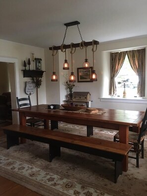 Large dining room with 9' reclaimed barnwood table big enough for whole family