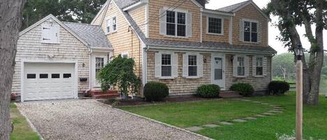 Front of House.  House has panoramic waterfront view of Little Pond bay.