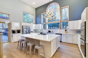 Enormous kitchen now faces the newly installed pool pavilion