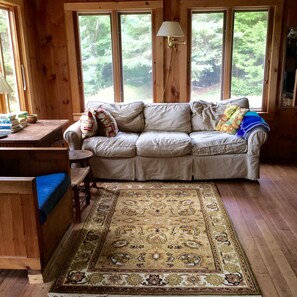 One sitting area has a comfy couch and chair that's great for reading. 