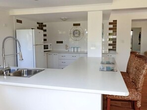 Well equipped kitchen with bench seating NB no oven 