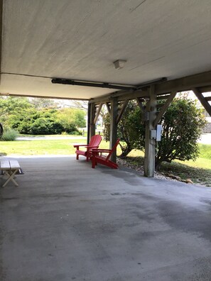 Covered carport and seating area.