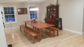 Open concept dining room with huge custom made farmers table
