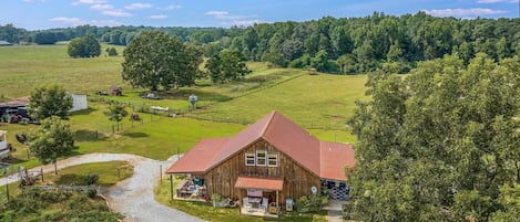 Aerial view of front of the Rustic Retreat and surrounding farm.