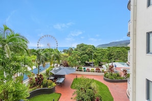 View of the ocean, garden, BBQ and pool from your balcony