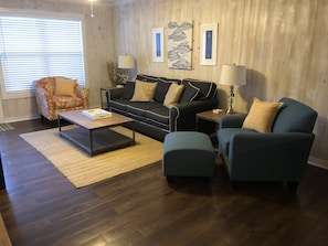 The spacious family room is great for relaxing after a long beach day.