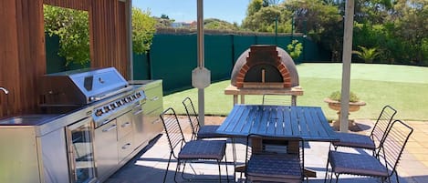 Outdoor gazebo. Outdoor BBQ kitchen, one of the eating areas, Wood Pizza Oven