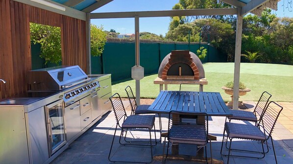 Outdoor gazebo. Outdoor BBQ kitchen, one of the eating areas, Wood Pizza Oven