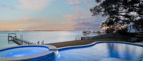 Relax in our new heated pool & spa with full-on views of The Santa Rosa Sound