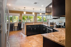 The large kitchen has ample counter space and storage to spread out.
