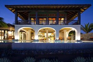 Front of the house, outdoor living area and interior at dusk