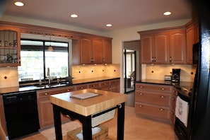 Brand new , heart of the house kitchen with pass thru window to lanai
