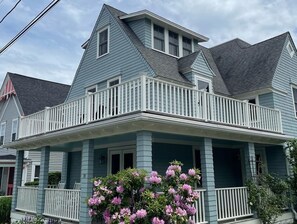 Large house with wraparound porch. One block to the beach. 