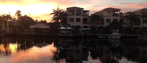 Beautiful sunset overlooking canal. Grill next to pool.  