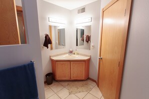 Second bathroom on the main floor with tub and shower.