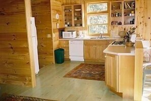 Large Renovated Kitchen complete with gas fireplace and breakfast table