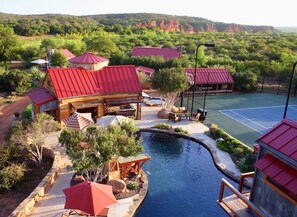 Poolside cabana/kitchen with a few of the guest cabins in background.