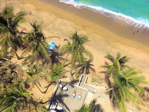 Our beachfront deck, famous Sandy Beach, and nothing but shades of blue beyond!