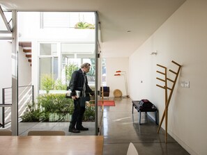 View of entry courtyard and living room.