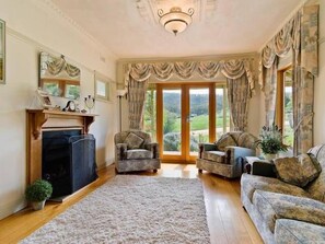 Front lounge room with opening french doors 
opening onto a verandah & sun deck.