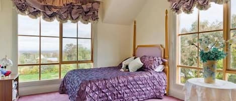 The double main bedroom includes two double beds and a private ensuite