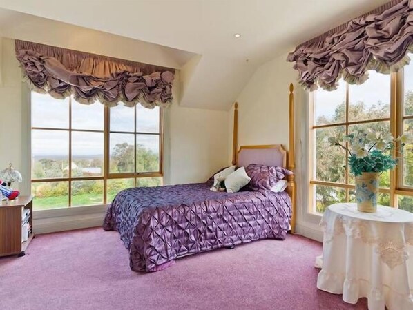 The double main bedroom includes two double beds and a private ensuite