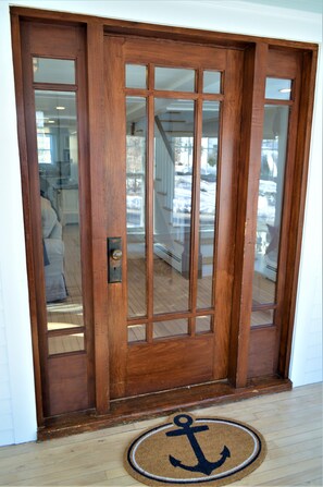 Gorgeous interior wood door.  Welcome!