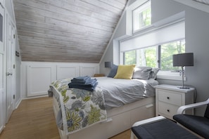 Upstairs master with shiplap ceiling and plenty of storage. 