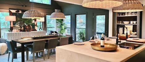 Beautiful micrcrete kitchen island viewing into luxurious RH dining room
