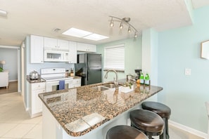 Open kitchen area, equipped with everything you need to make meals in the unit