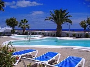 POOL SURROUNDED BY LARGE TERRACE WITH SEA VIEWS