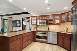 Gourmet Kitchen - Full Granite - Mahogany Cabinets - Zero Noise Dishwasher. 