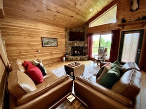 Phenomenal Mountain Views surround you while relaxing in the Cozy Living Room