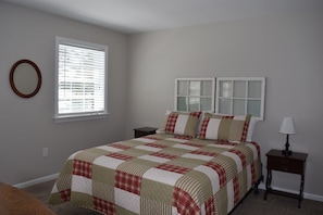 Queen bed with attached Jack and Jill bathroom with a shower. 