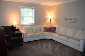 Second family room with lots of comfortable seating, large TV,  and DVD Player