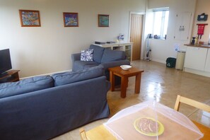 The living area has a flat screen TV with freeview, DVD player and PS3
