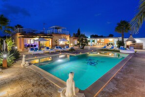 Enchanting villa with private pool, BBQ, chillout and dining areas by night