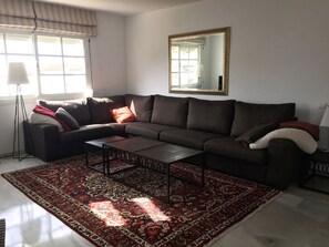 Large, beautiful corner sofa in the living room.