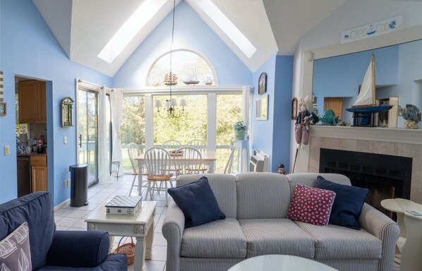 Living/dining room with view of 9th hole. Skylights. So bright and attractive.
