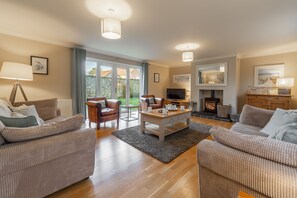 The Old Butcher's Shop, Docking: Sitting room with wood burning stove