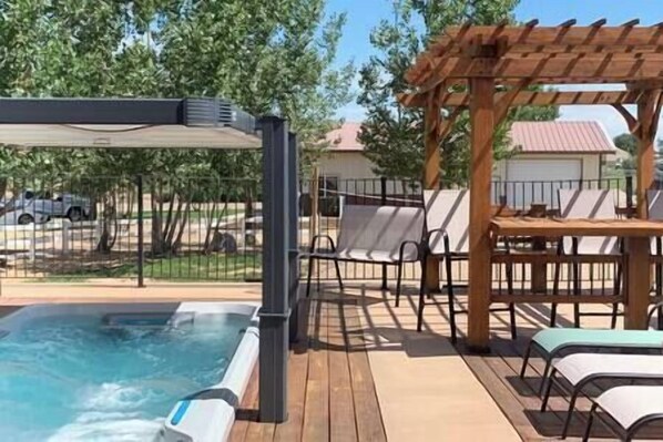 35 foot swim spa with pergola and seating - open year round and heated
