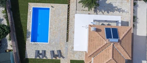 Bird's eye view of the spacious villa and pool.