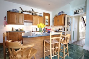 The Hub with breakfast bar and wood burning stove for cosy winter evenings