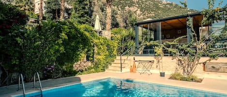 Pool side with sun room