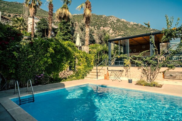 Pool side with sun room